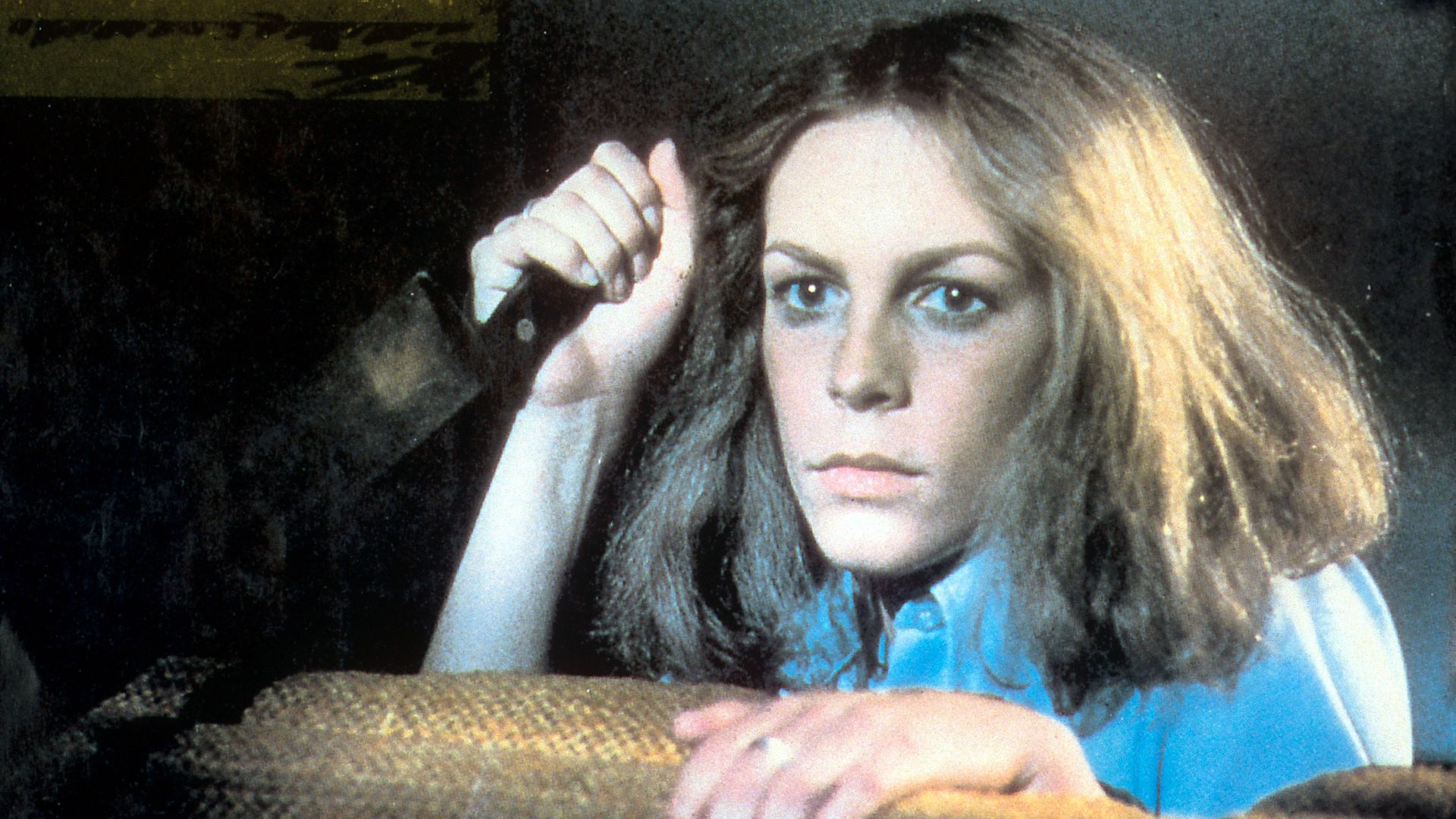 Jamie Lee Curtis holds a knife in a scene from the film 'Halloween', 1978.