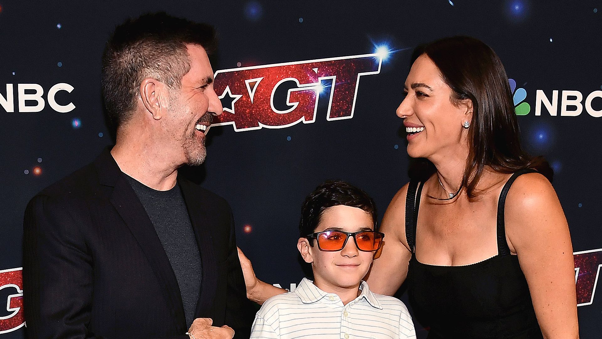 Simon Cowell's son Eric, 9, looks so grown up for rare red carpet appearance with mother Lauren Silverman