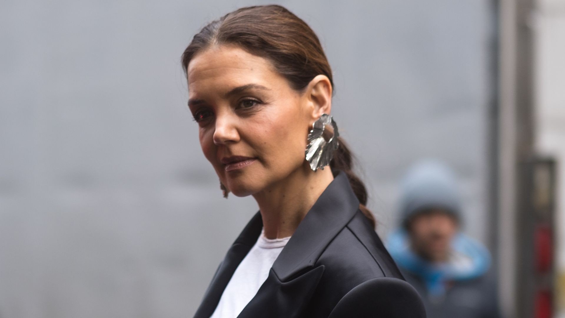 Katie Holmes’ silky midi skirt and knee high boots combo is bang on trend for 2025