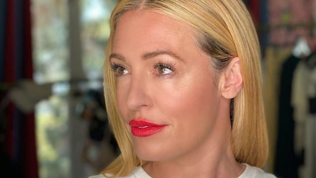 Cat Deeley wearing a white top with red lipstick