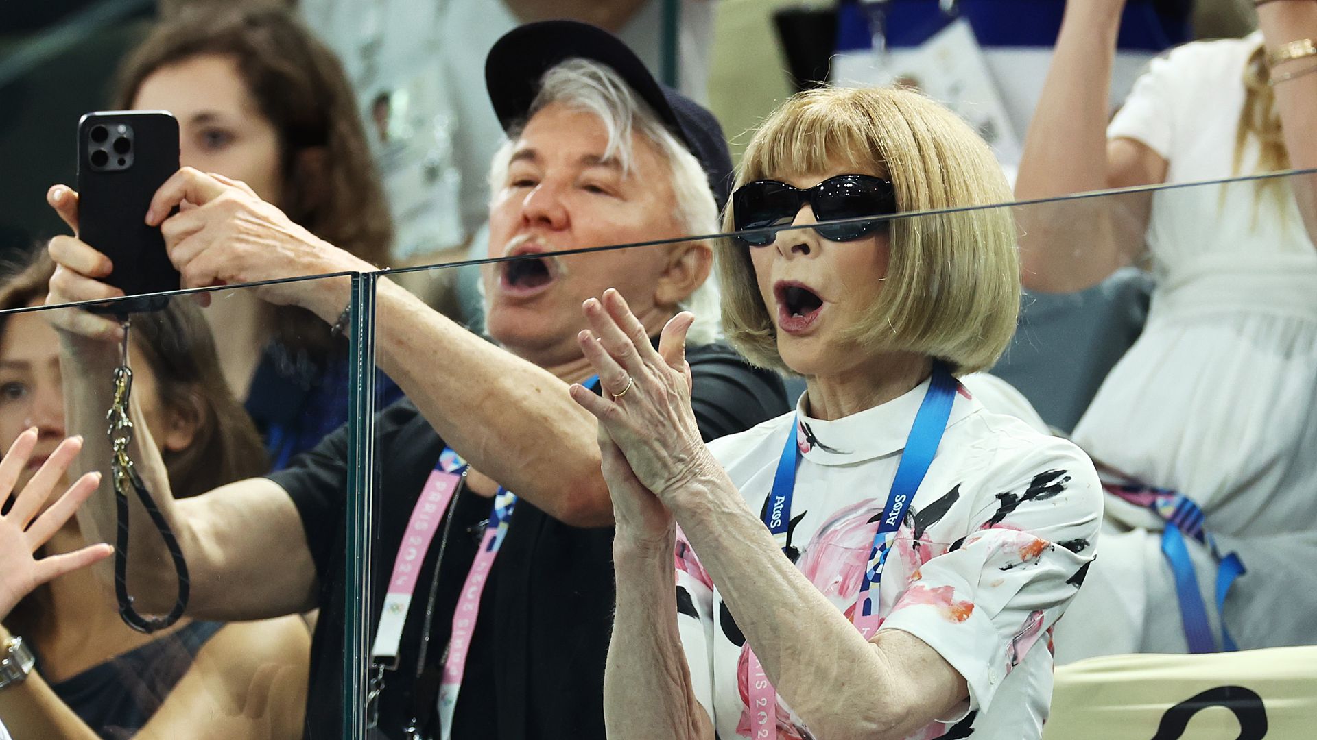 Anna Wintour and Baz Luhrmann compete in the women's artistic gymnastics qualification on the second day of the Paris 2024 Olympic Games at Bercy Arena on July 28, 2024 in Paris, France.