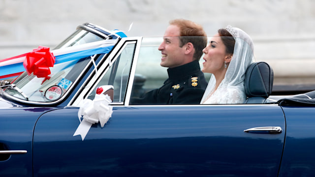 Newlyweds William and Kate leave Buckingham Palace in the then Prince of Wales's prized Aston Martin DB6