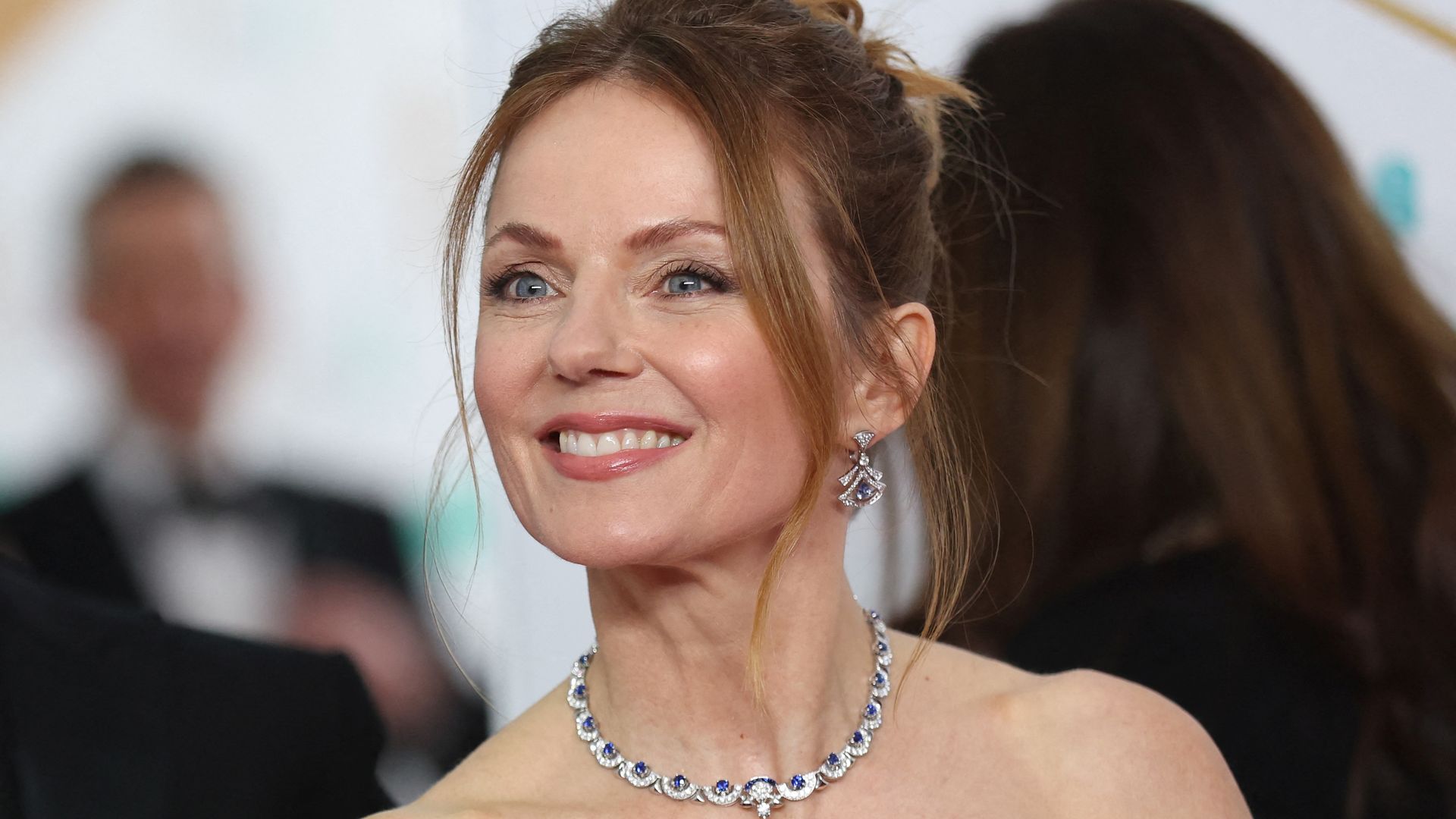 Geri Halliwell-Horner looks unrecognisable with Y2K platinum blonde curls and slinky Cannes dress