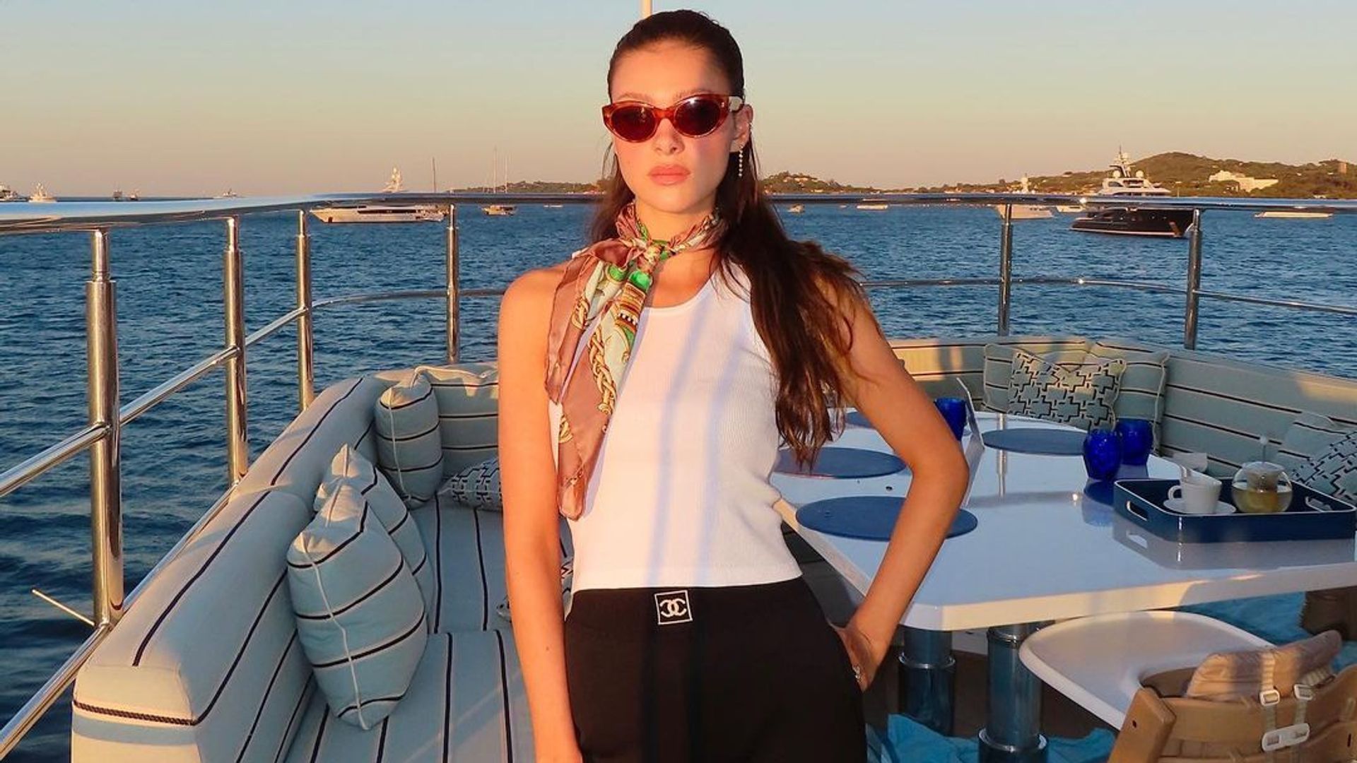 Nicola Peltz wears Chanel on board a luxury yacht