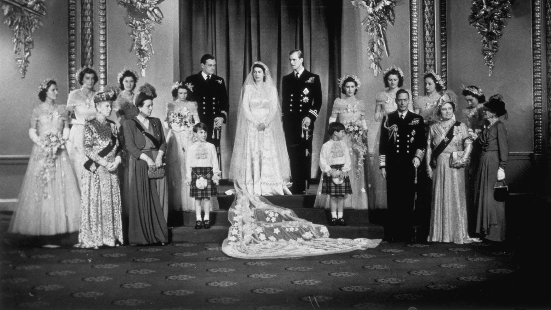 A group of people taking a wedding portrait