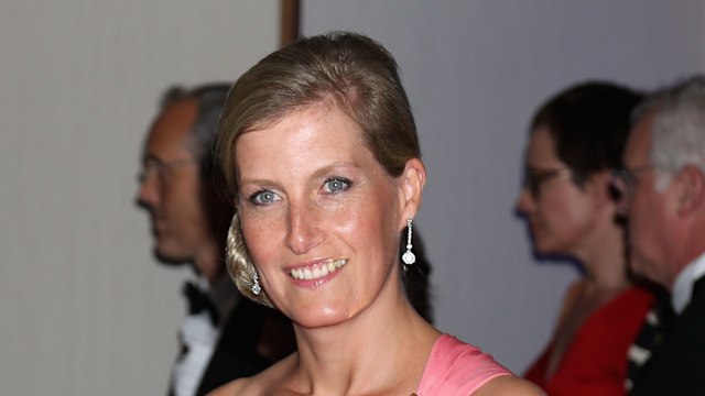 Duchess Sophie smiling in a one-shoulder pink dress