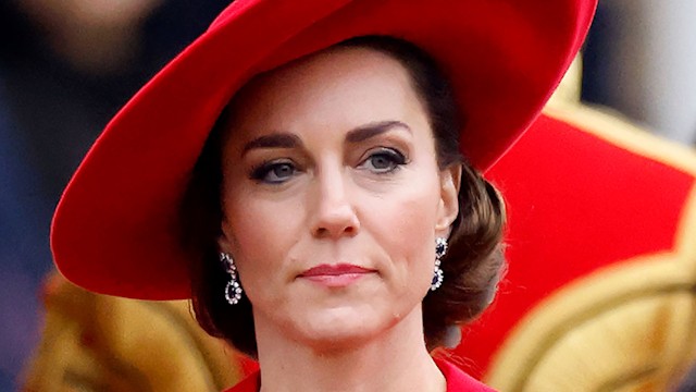 Kate Middleton wearing red dress and hat