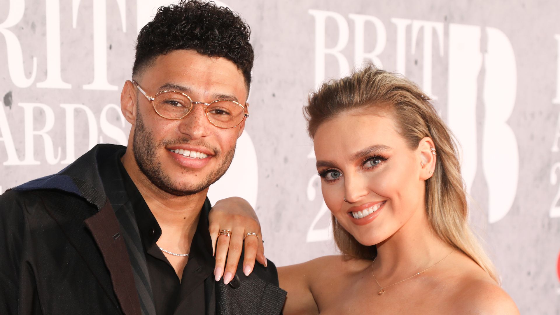 LONDON, ENGLAND - FEBRUARY 20: (L-R) Alex Oxlade-Chamberlain and Perrie Edwards of Little Mix during The BRIT Awards 2019, The O2 Arena, London, England, on 20 February 2019. (Photo by JM Enternational/Getty Images)