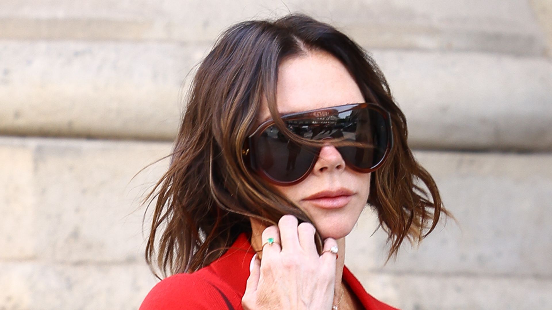 Victoria Beckham wearing red, is seen on June 10, 2025 in Paris, France. 