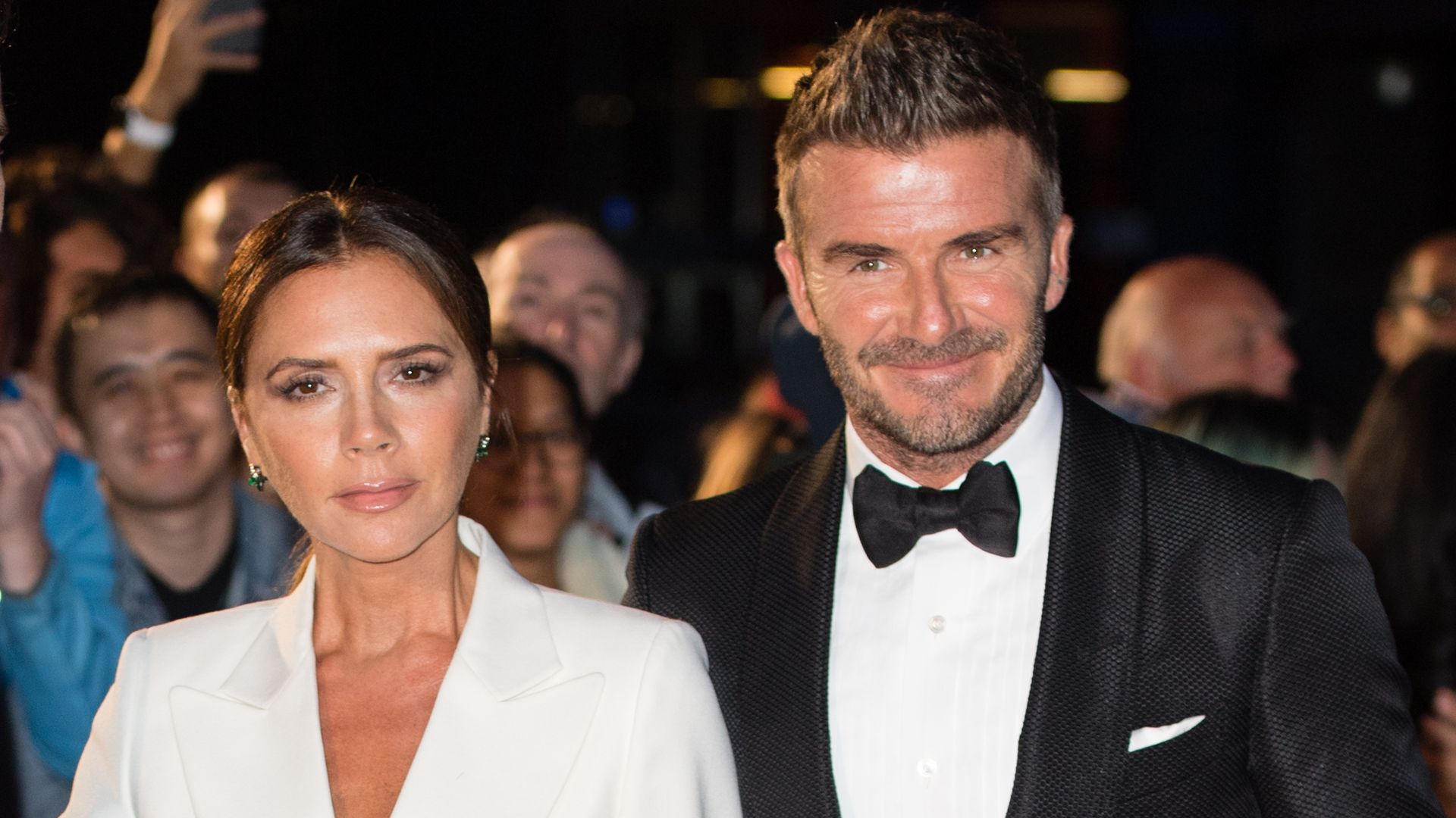 Father-of-the-groom David Beckham channels James Bond in family wedding photo