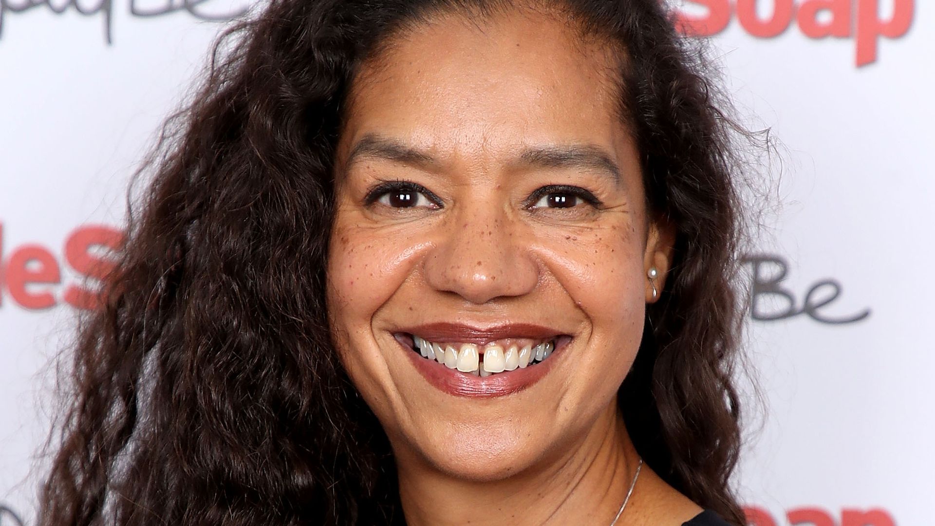 Jaye Griffiths smiling at a red carpet event