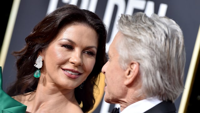 couple looking at each other on red carpet