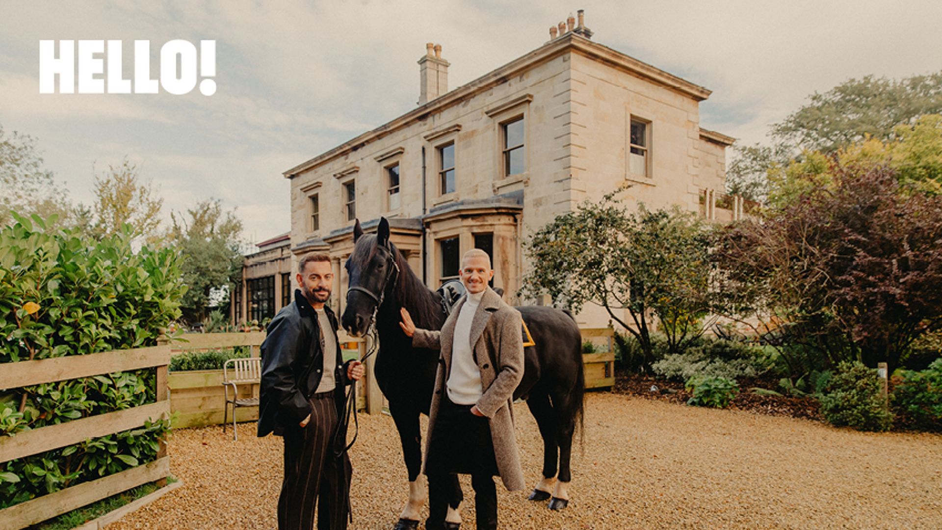 Ben Forster and his partner with a horse in front of their home 