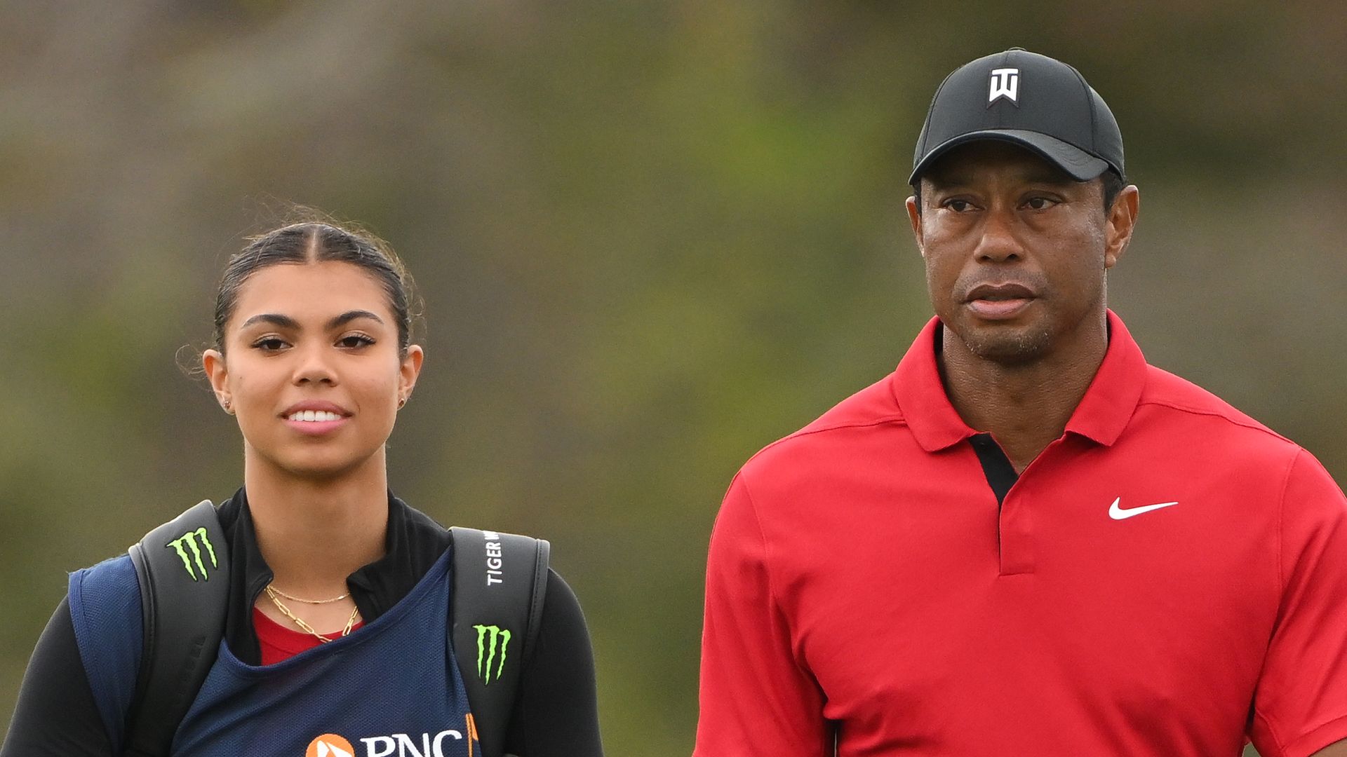 Tiger Woods and his daughter, Sam Woods, walk onto the 15th green during the final round of the PNC Championship at Ritz-Carlton Golf Club on December 17, 2023 in Orlando, Florida