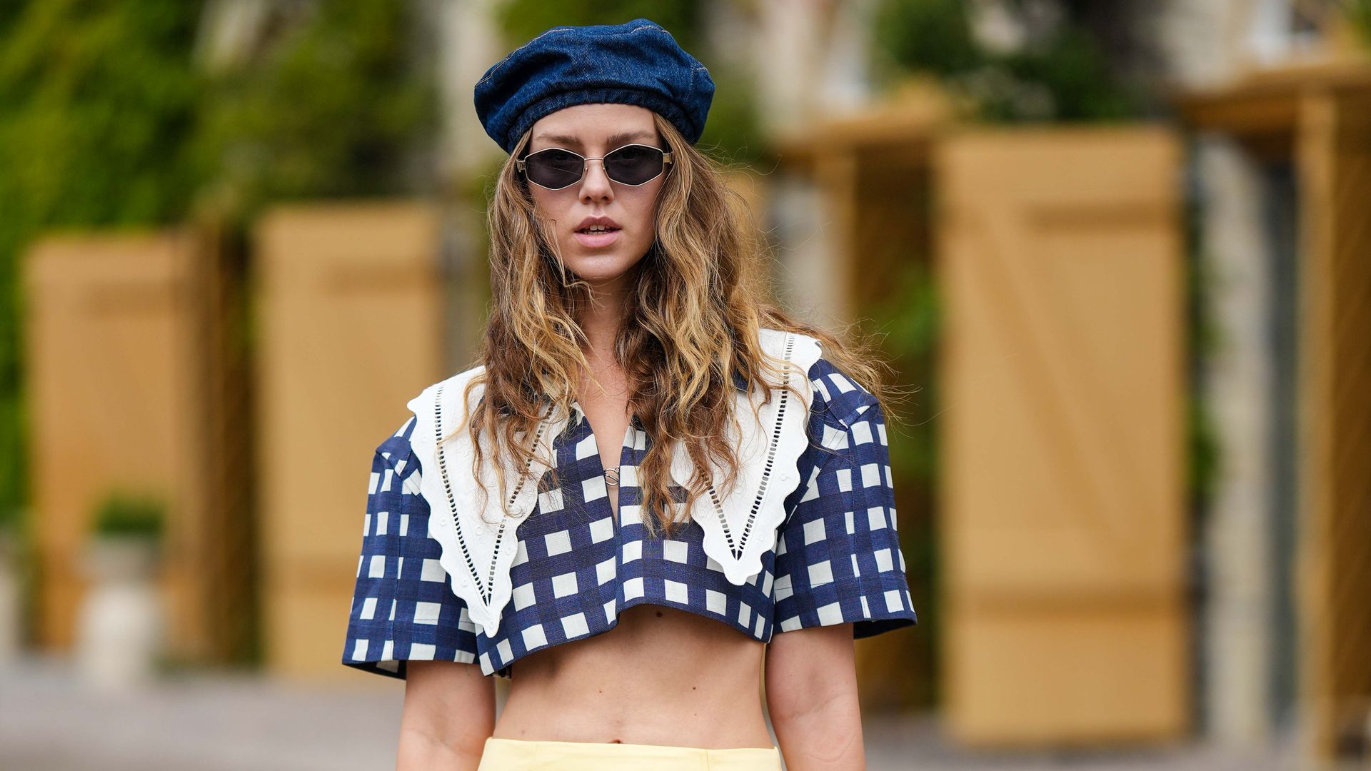 Fashion week guest wearing beret and cropped blouse 