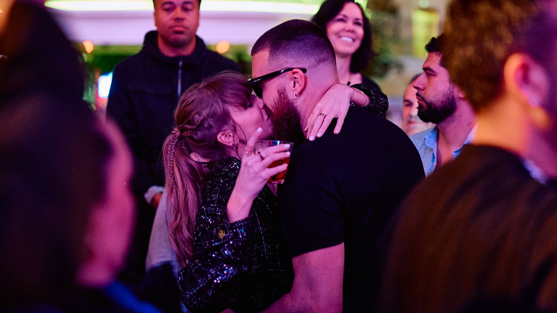 Taylor Swift and Travis Kelce Share Celebratory Kiss inside DJ Booth at XS Nightclub inside Wynn Las Vegas on Feb. 11 after the Kansas City Chiefs' Super Bowl win