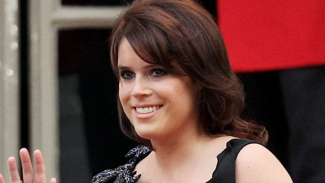 Princess Eugenie waving in a black dress