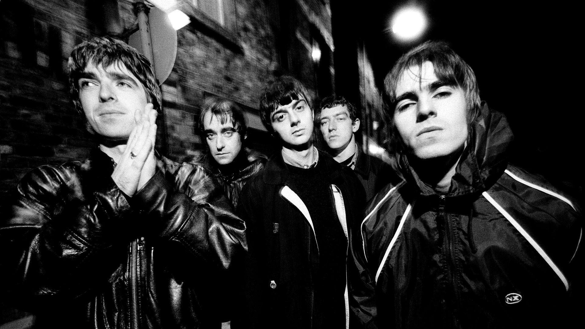 Group portrait of British rock band Oasis in Manchester, United Kingdom, 29th November 1993. L-R Noel Gallagher, Paul Arthurs (aka Bonehead), Paul McGuigan, Tony McCarroll,Liam Gallagher