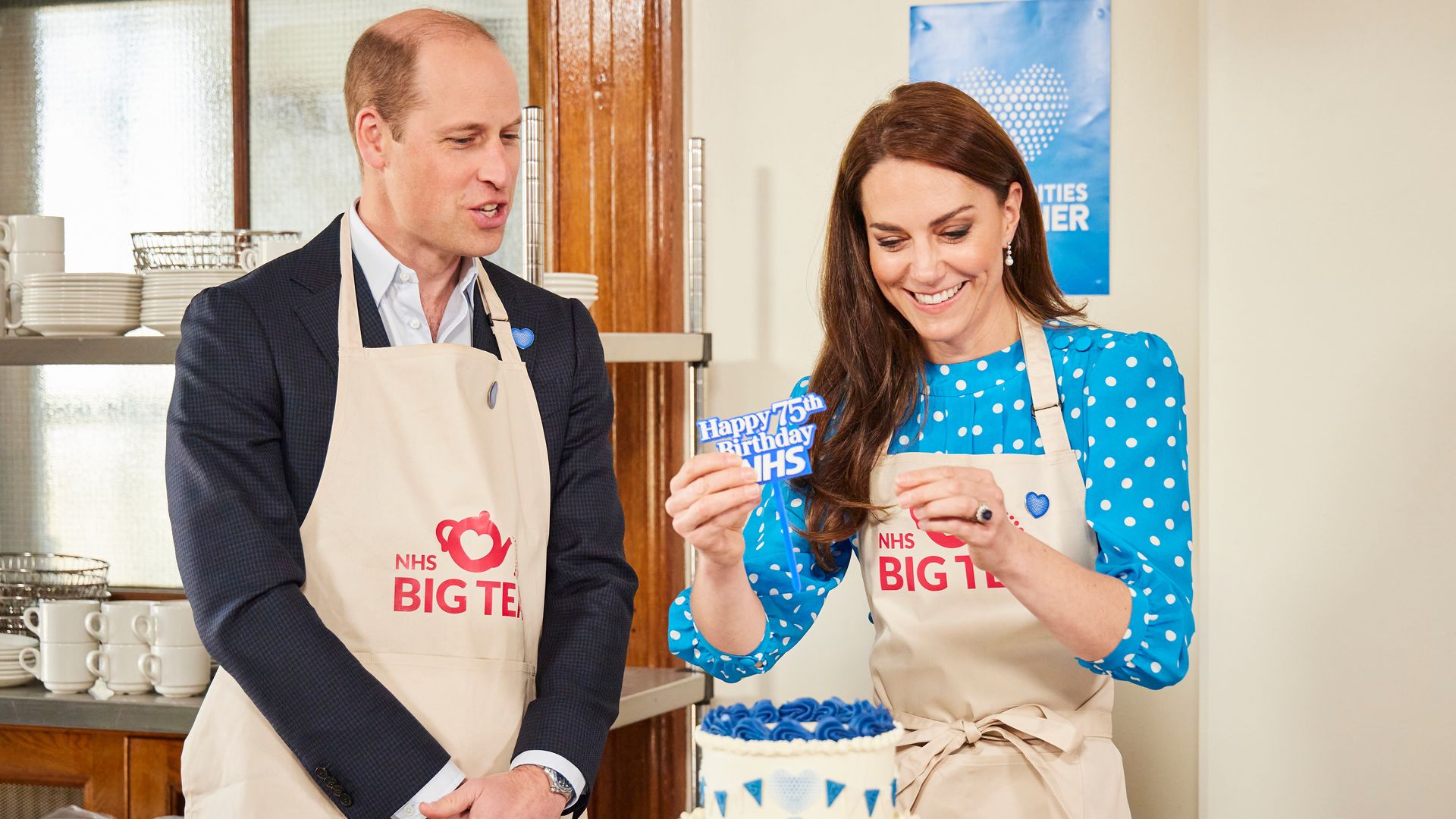 Prince William and Catherine Princess of Wales places a topper on NHS Big Tea cake