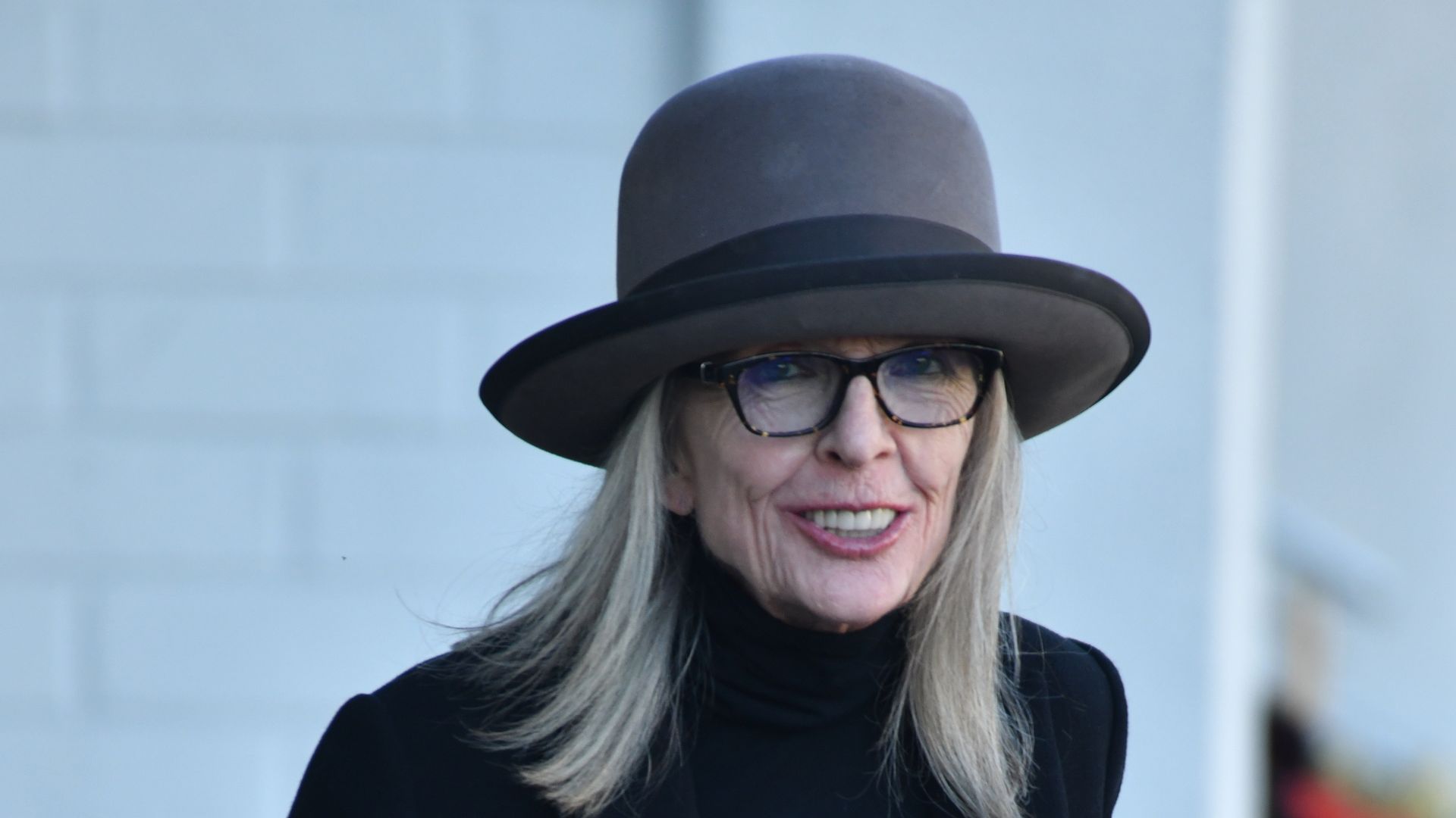 Diane wearing one of her signature hats