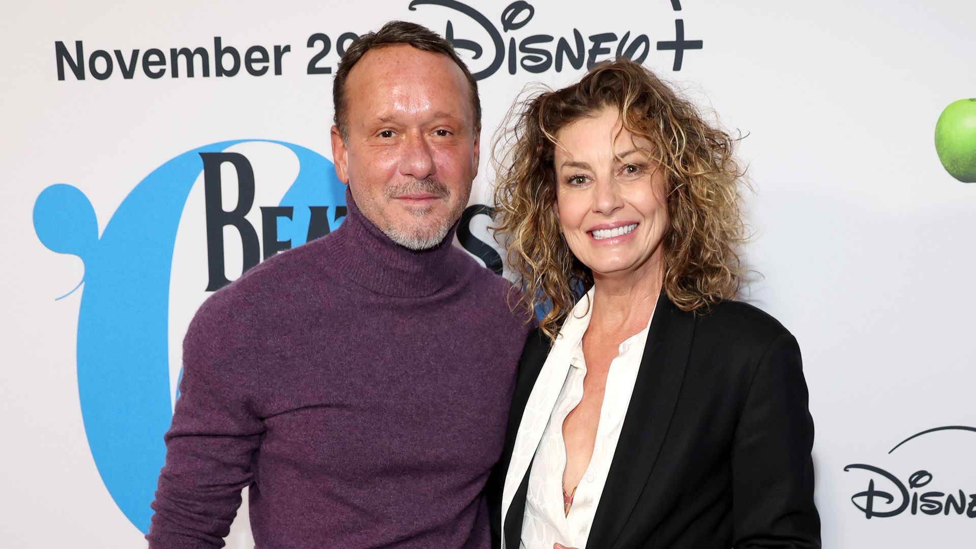 tim mcgraw and faith hill on red carpet in casual clothes