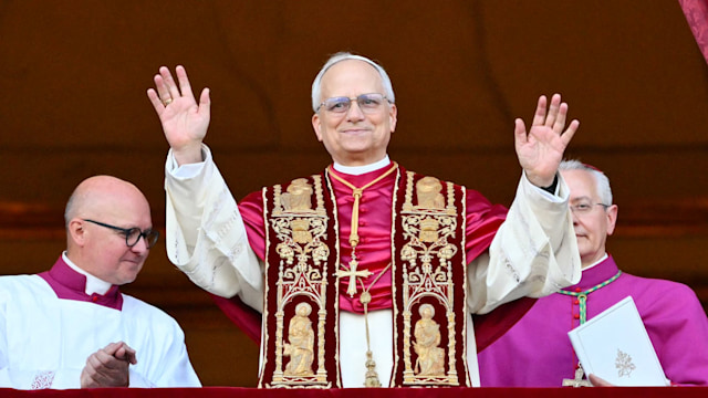 Newly elected Pope Leo XIV, Robert Francis Prevost arrives on the main central loggia balcony of the St Peter's Basilica for the first time