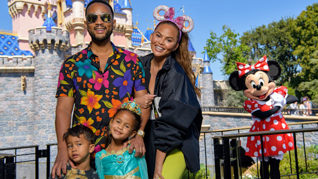 ANAHEIM, CALIFORNIA - APRIL 14: In this handout photo provided by Disneyland Resort, John Legend, Chrissy Teigen and their children, Miles and Luna pose with Minnie Mouse while celebrating Lunaâs birthday at Disneyland on April 14, 2022 in Anaheim, California. (Photo by Richard Harbaugh/Disneyland Resort via Getty Images)
