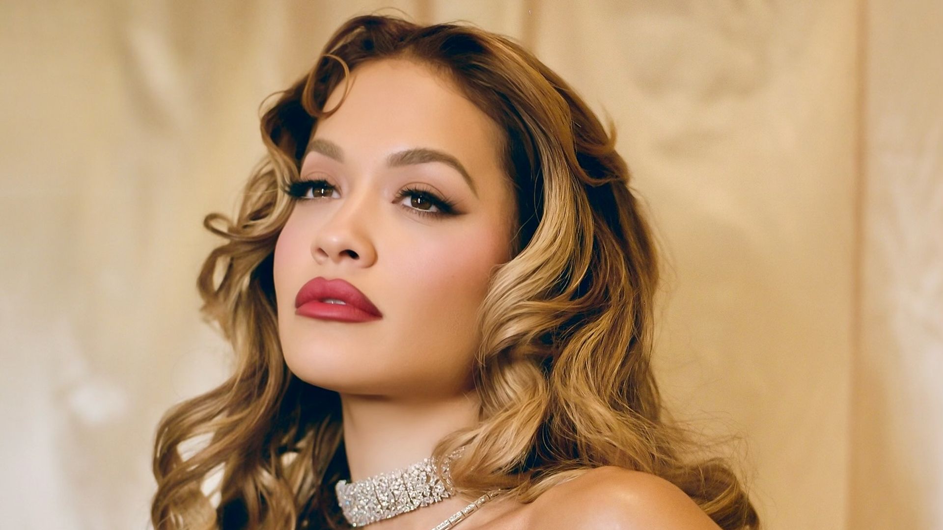 Rita Ora’s low-cut crystal-encrusted gown and bouncy blow out is a date night dream