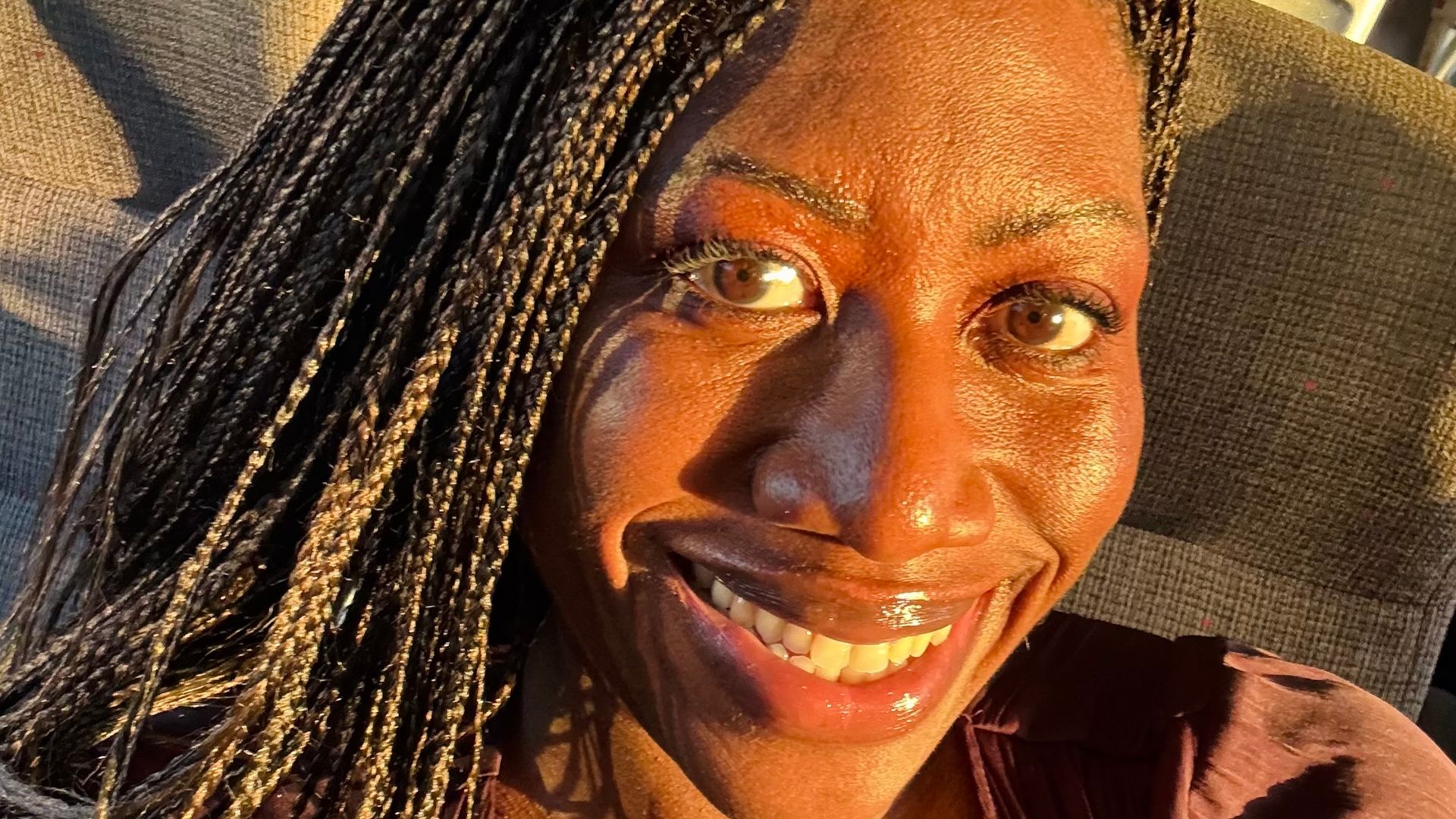 selfie of ateh jewel smiling in golden sunlight 