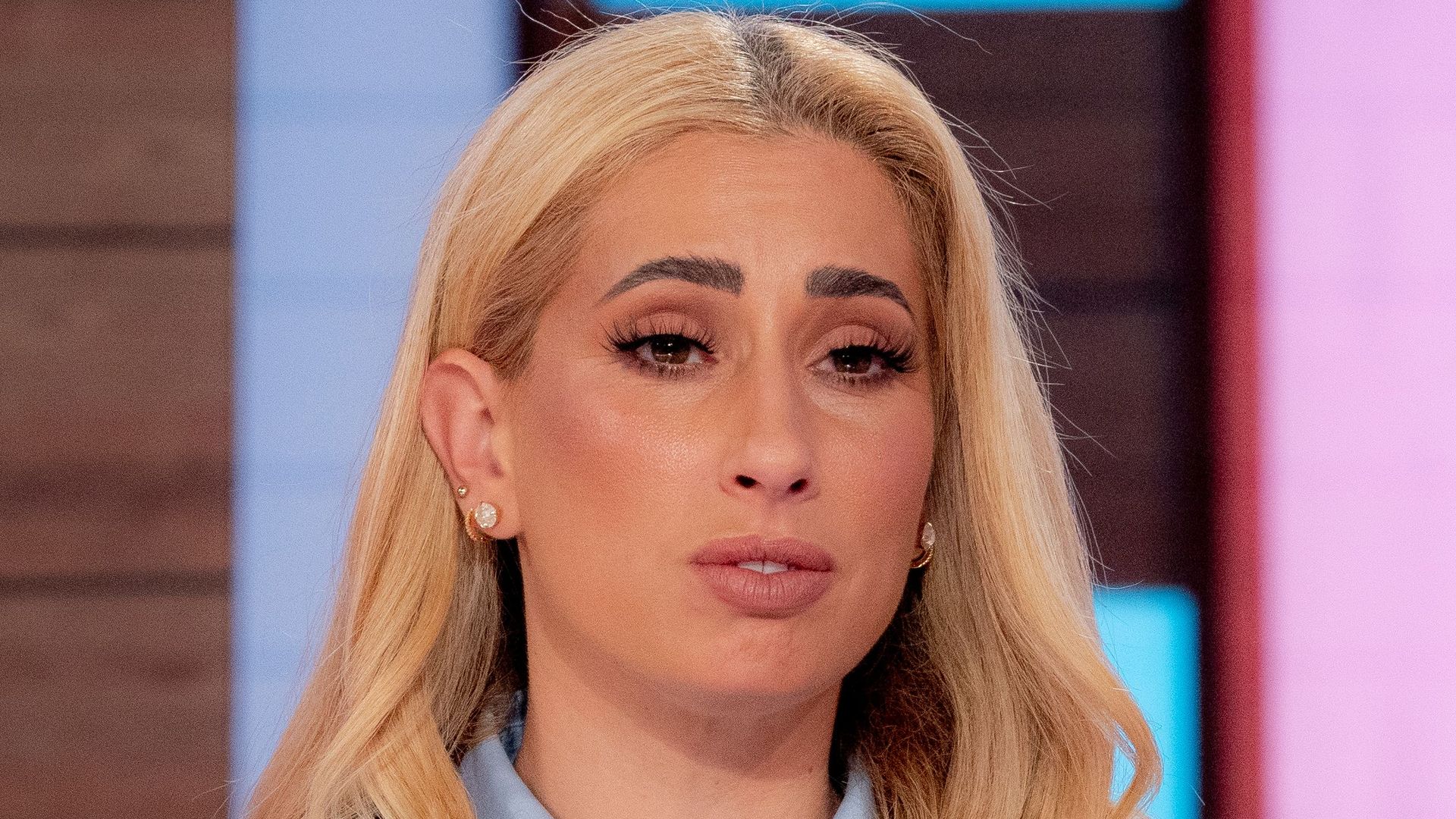 star on loose women show in blue ruffle dress 