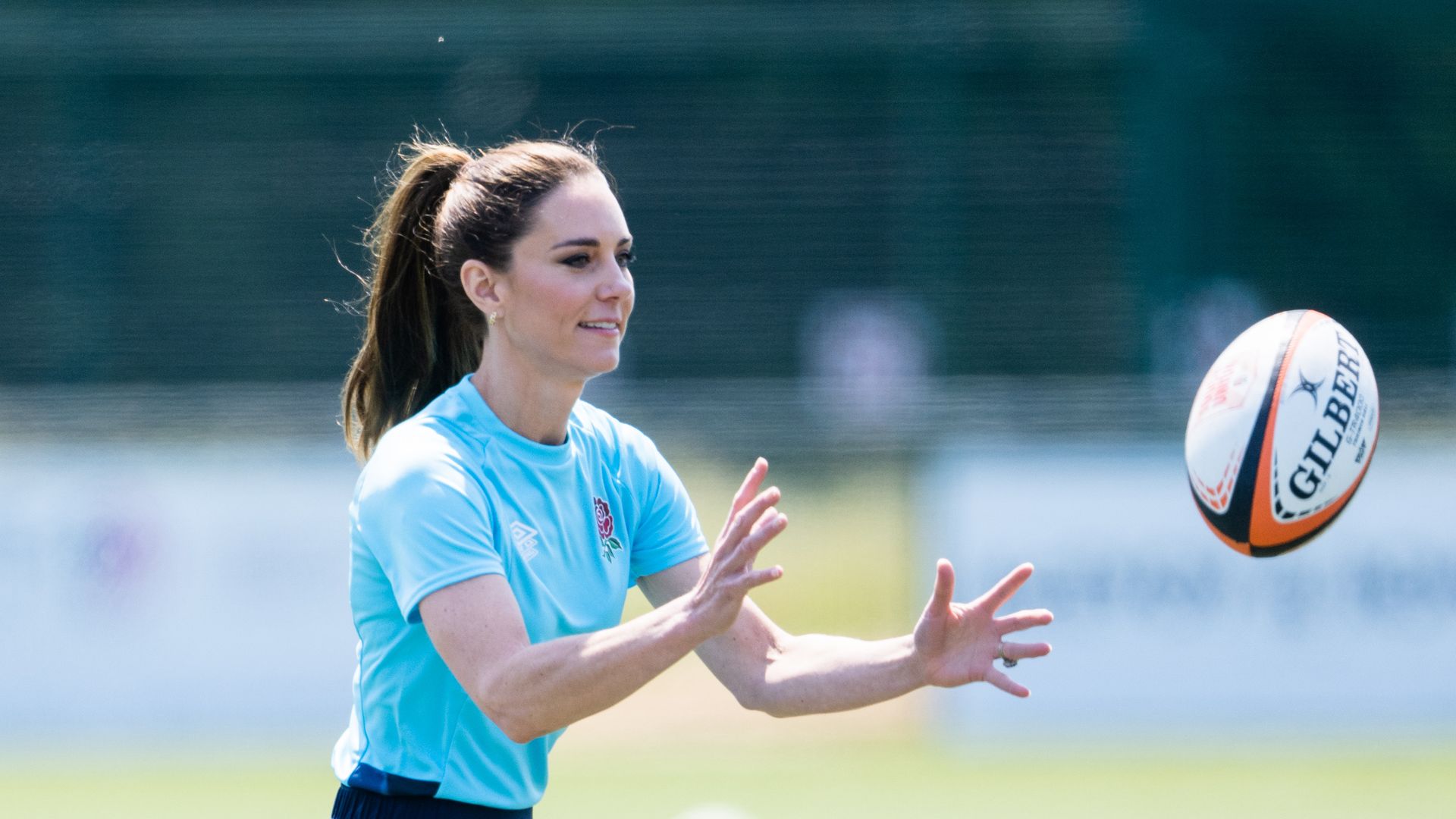 Kate Middleton catches rugby ball at Maidenhead Rugby Club