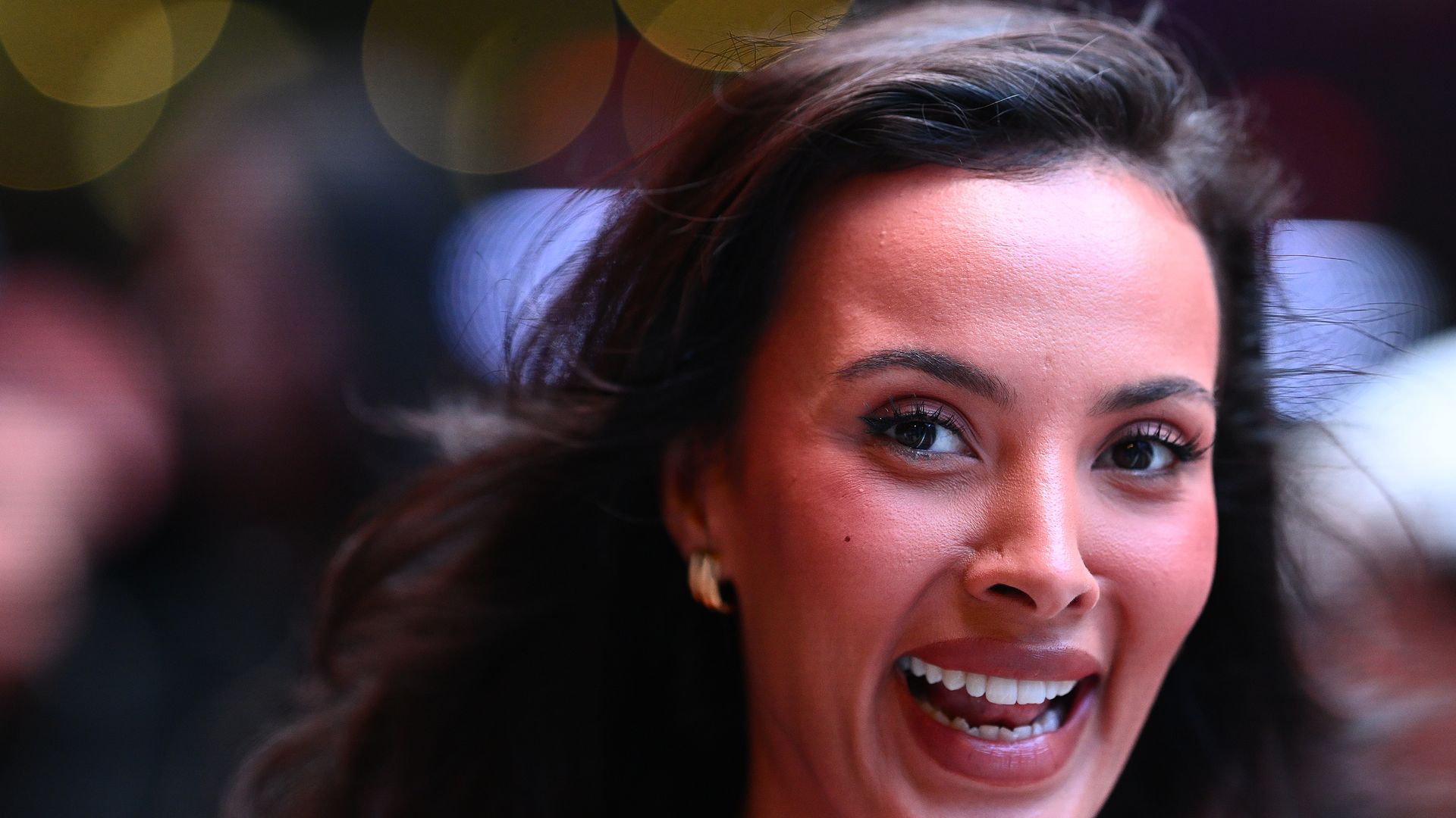 Maya Jama smiling widely