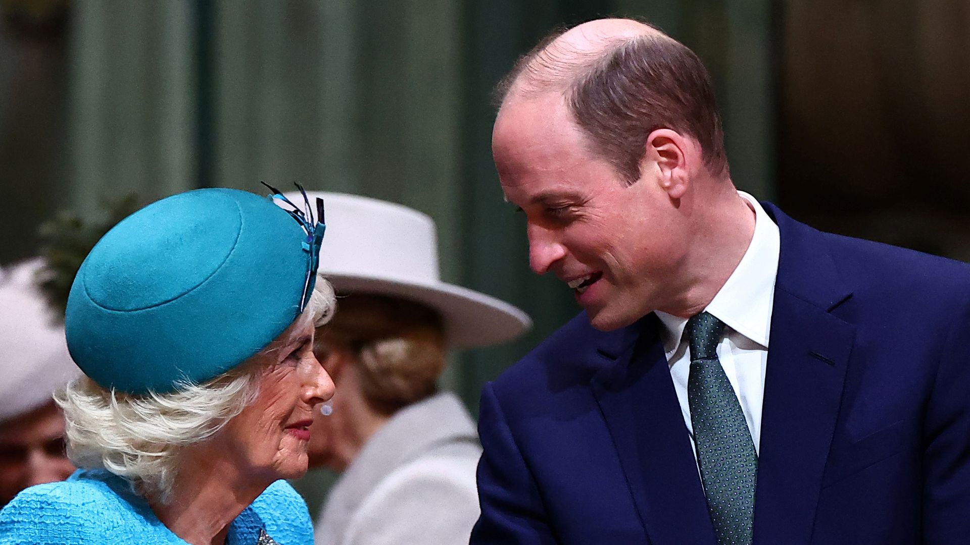 Prince William smiles at Queen Camilla 