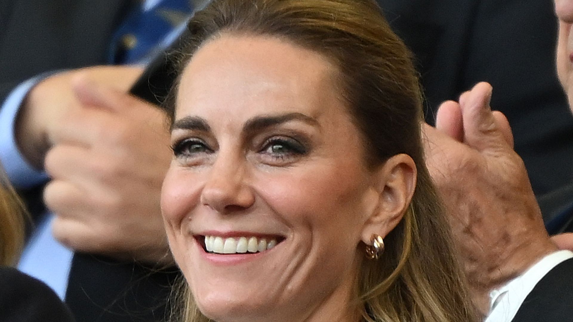 Catherine, Princess of Wales in stands clapping in black suit and white blouse