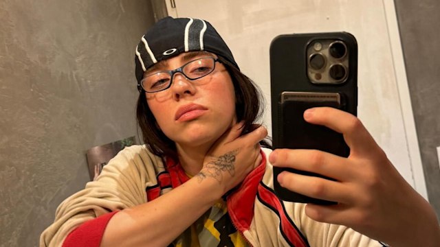 Billie Eilish showcasing tattoo collection