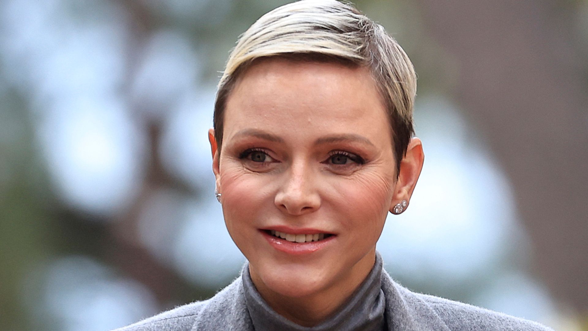 Princess Charlene's balletic updo conceals long hair transformation