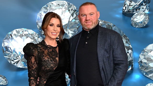 Coleen Rooney' and wayne with diamond backdrop