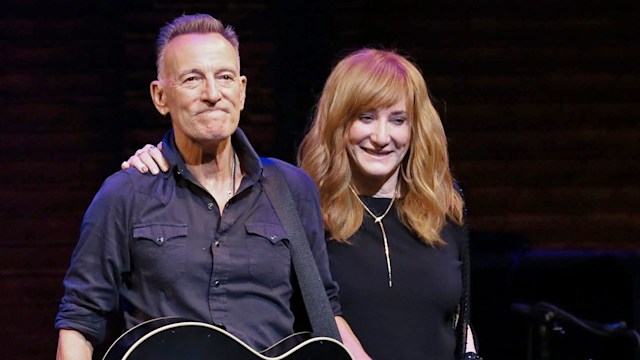 Bruce Springsteen standing with Patti Scialfa