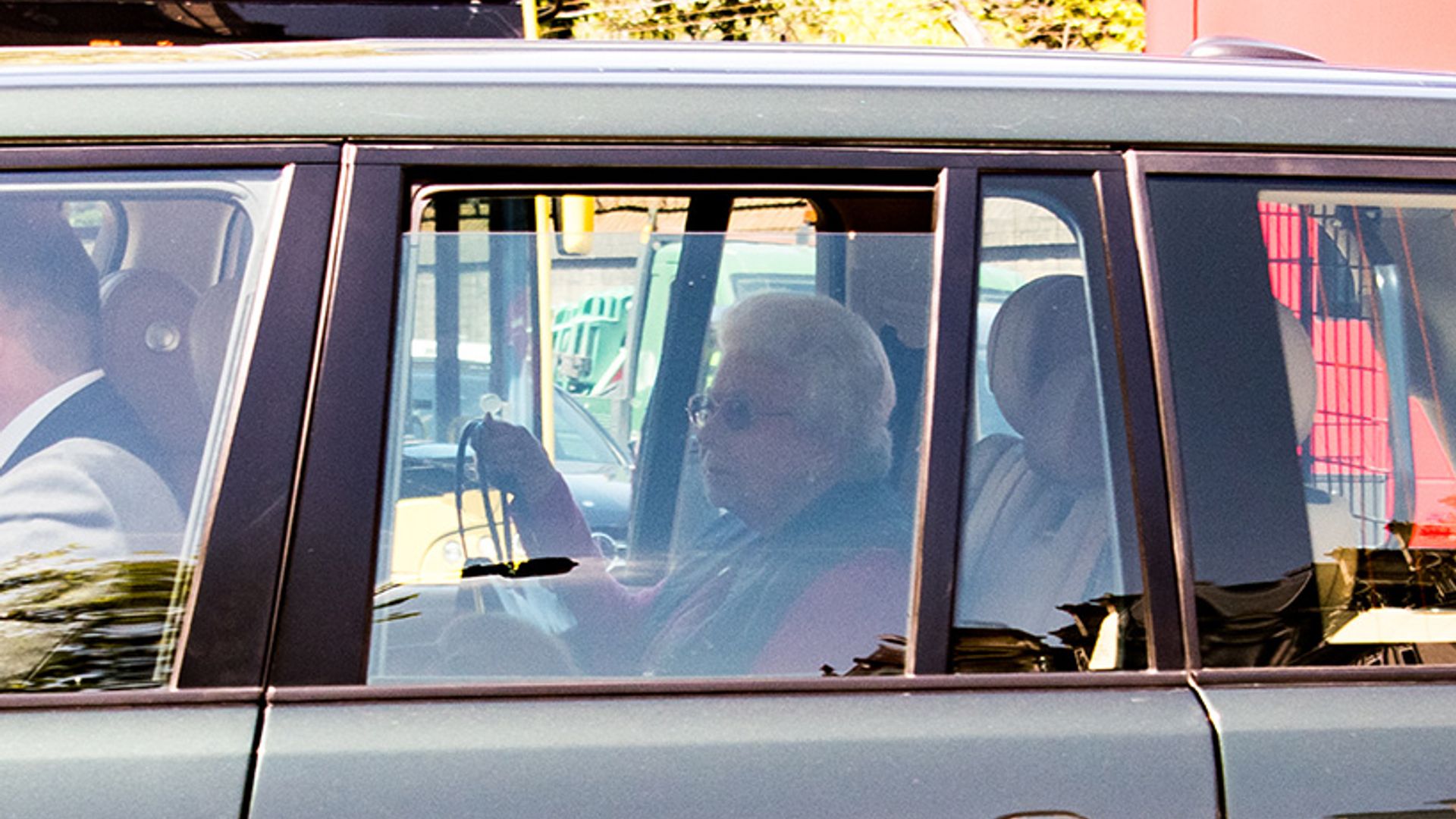 the queen in car
