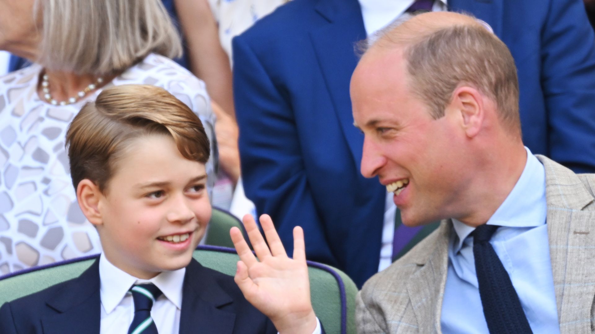 Prince George waving and Prince William laughing at him