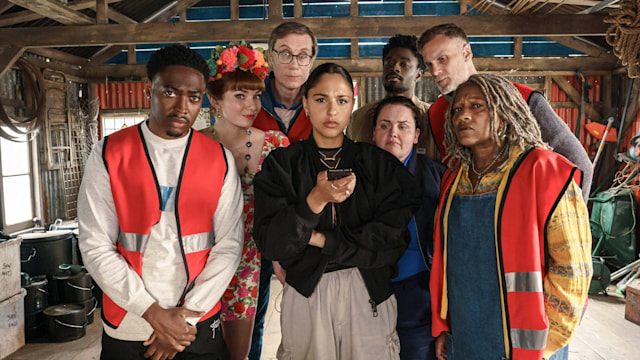 Ben (GAMBA COLE), Gabby (ELEANOR TOMLINSON), Greg (STEPHEN MERCHANT),Rani (RHIANNE BARRETO), Diane (JESS GUNNING), Malaki (CHARLES BABALOLA), Myrna (CLARE PERKINS), John (DARREN BOYD) in The Outlaws