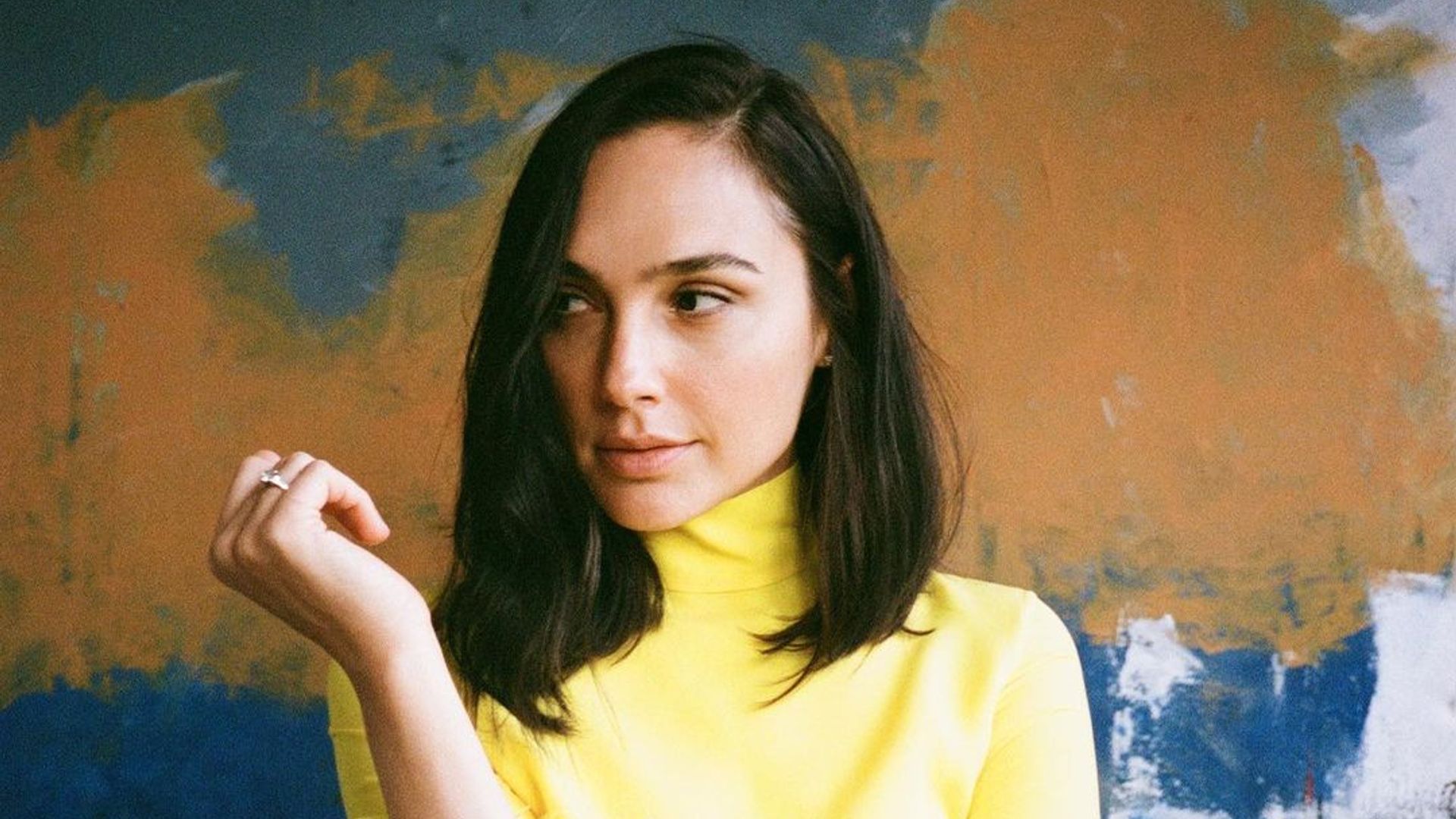 Gal Gadot looks incredible in a yellow feathered dress