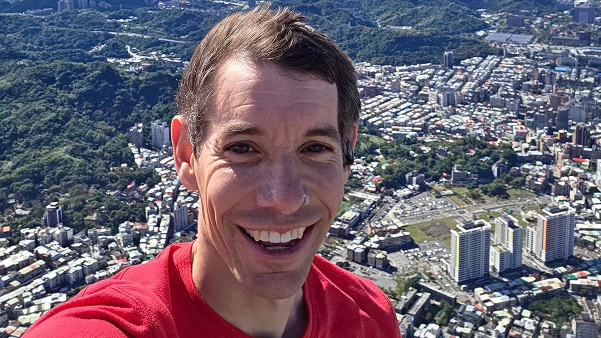 Alex Honnold takes a selfie atop the Taipei 101 tower after his historic climb for Netflix, shared on Instagram