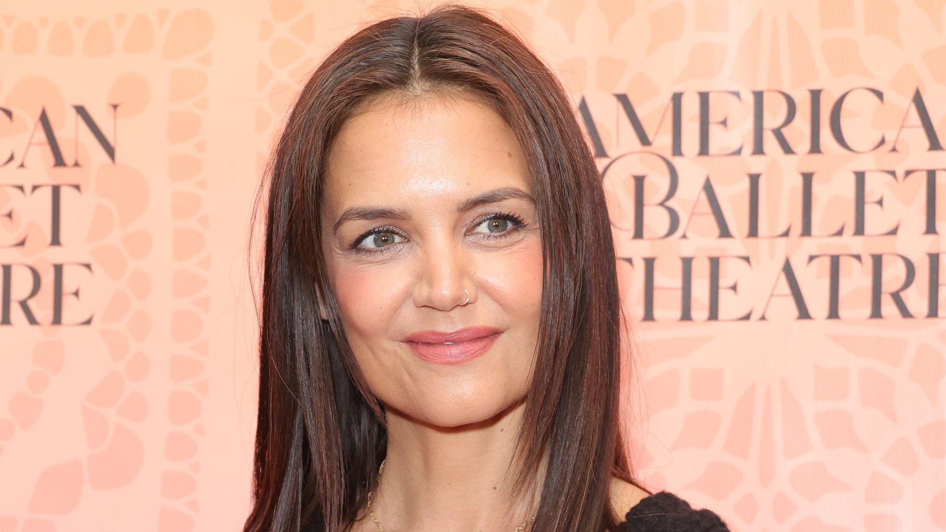 Katie Holmes showcases her incredible physique in tight black dress