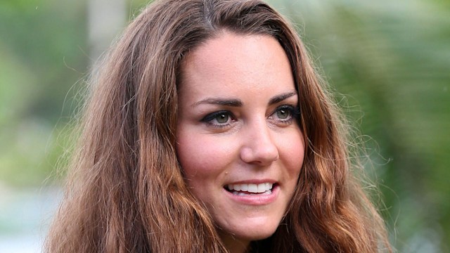 Kate Middleton smiles with bushy curly hair