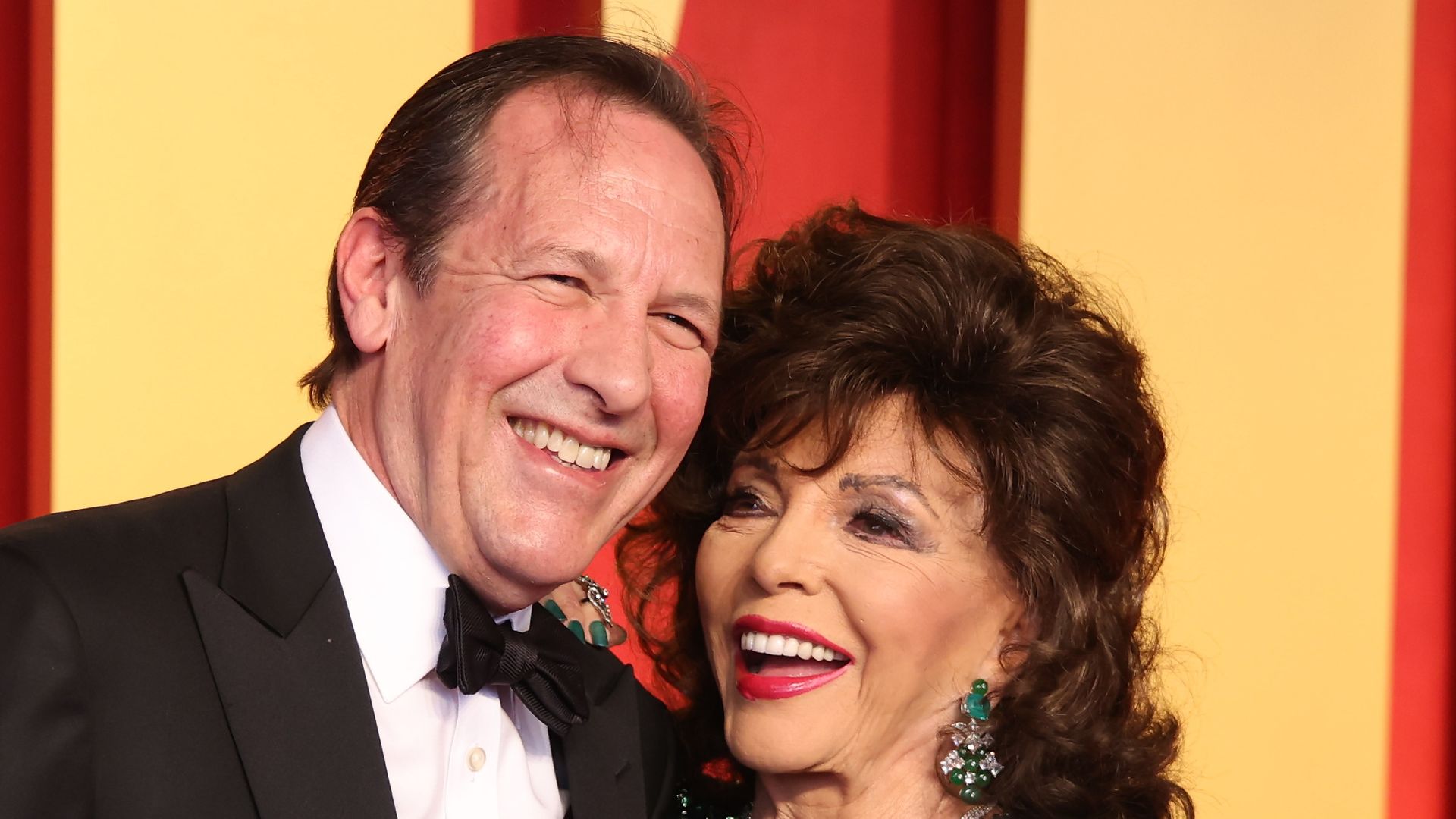 Joan Collins, 91, amazes in bridal-white dress for night out with husband Percy