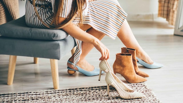 Woman trying on different shoes