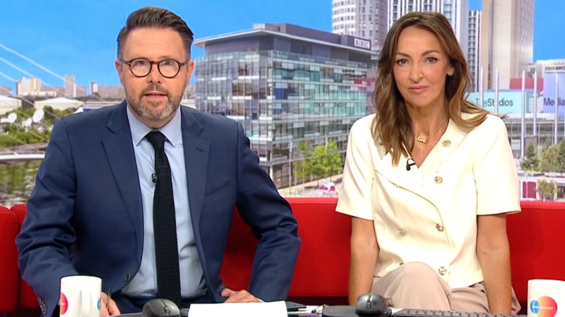 presenters on red sofa in tv studio