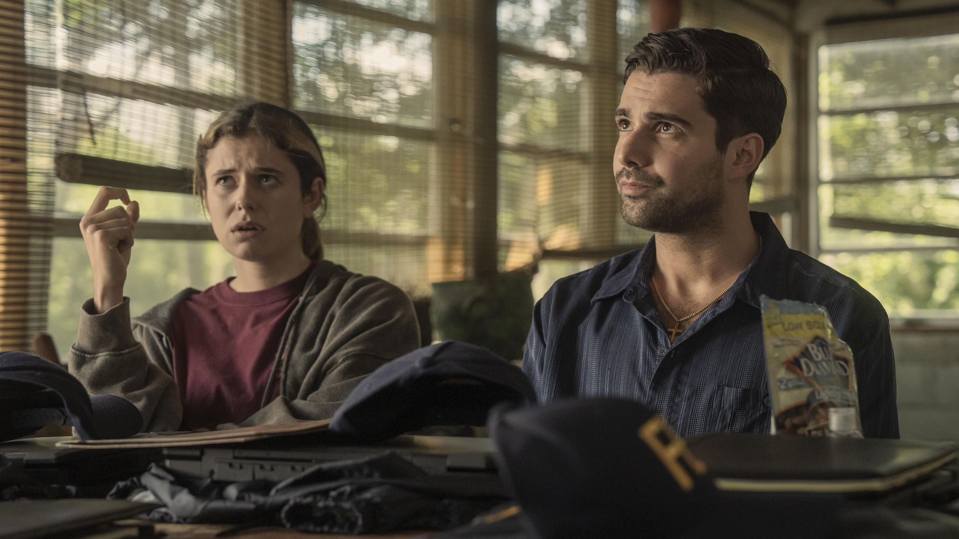 woman and man sitting at desks