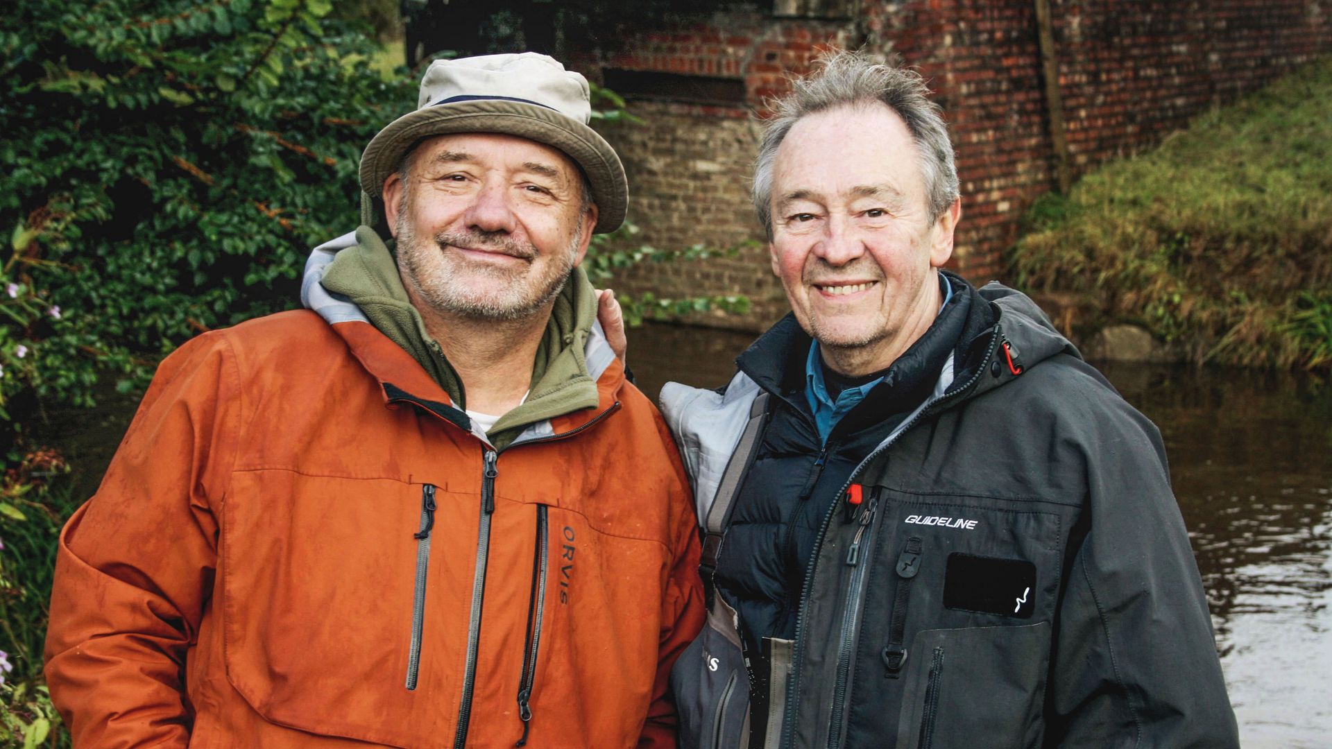 Bob Mortimer and Paul Whitehouse by a river in Mortimer & Whitehouse: Gone Fishing